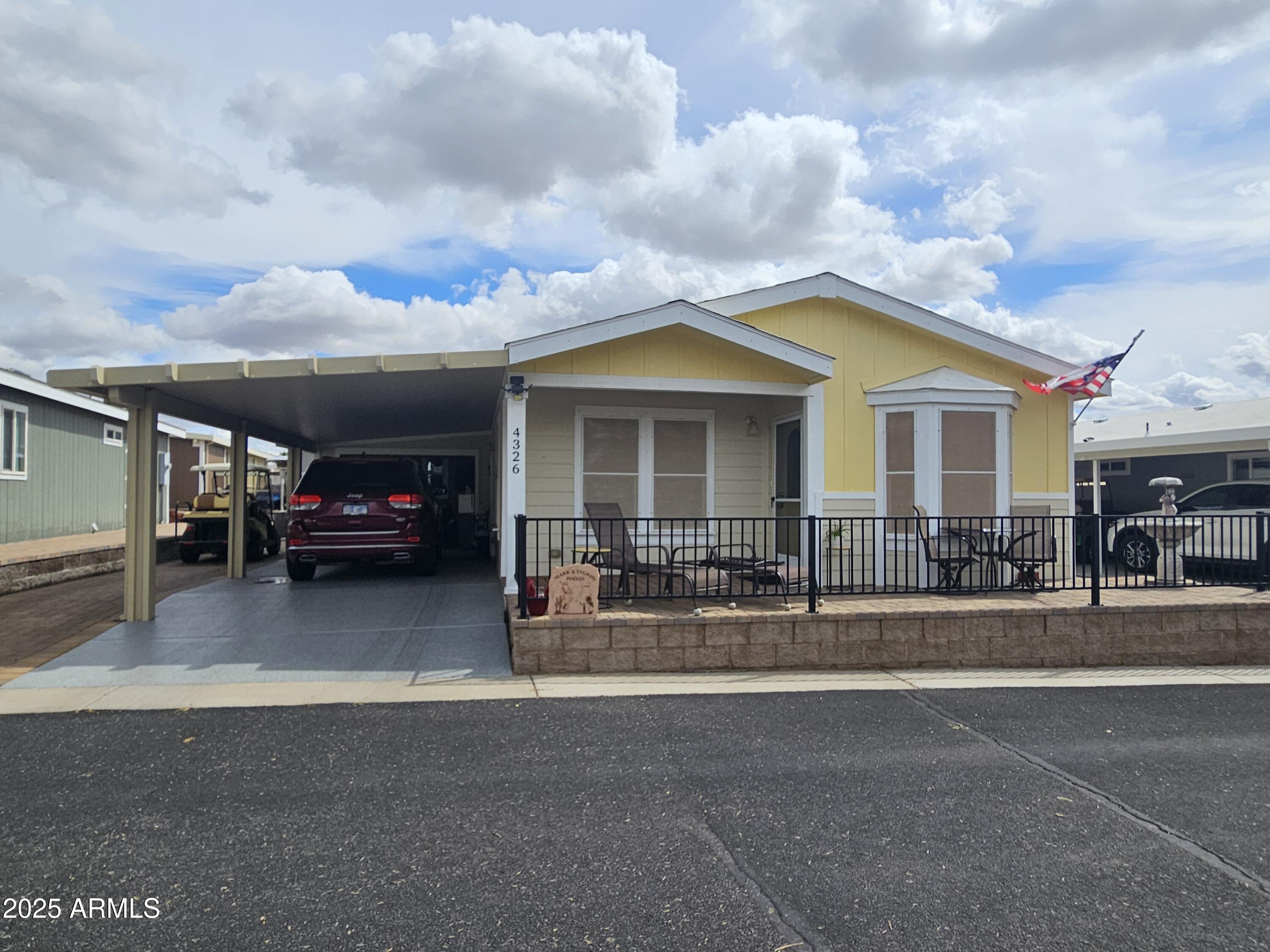 650 North Hawes Road, Unit 4326 Mesa, AZ 85207 - Photo 8 of 48 a car parked in front of a house