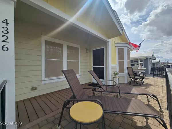a patio with table and chairs