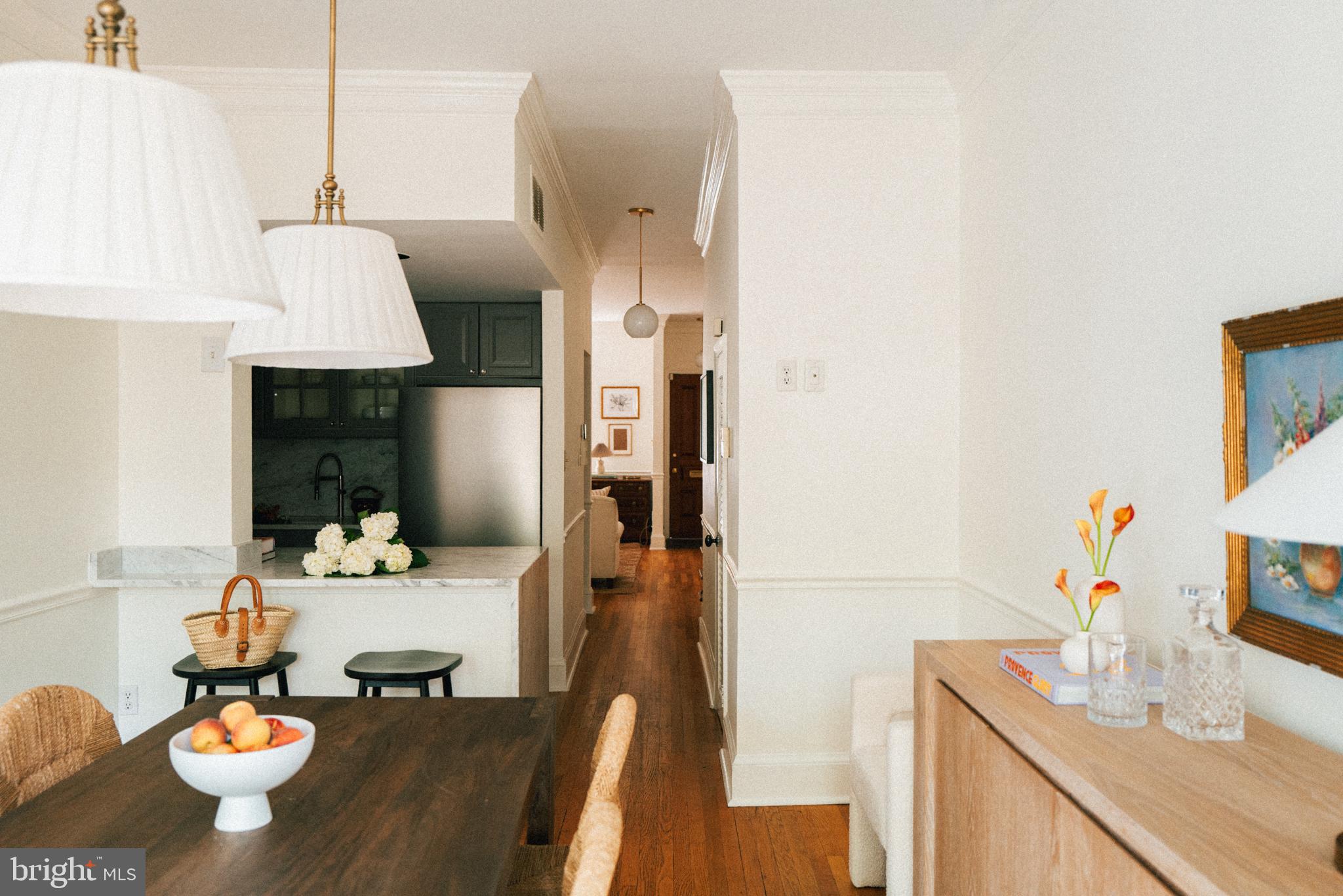 708 9th Street Southeast Washington, DC 20003 - Photo 11 of 31 a dining room with furniture and a kitchen view