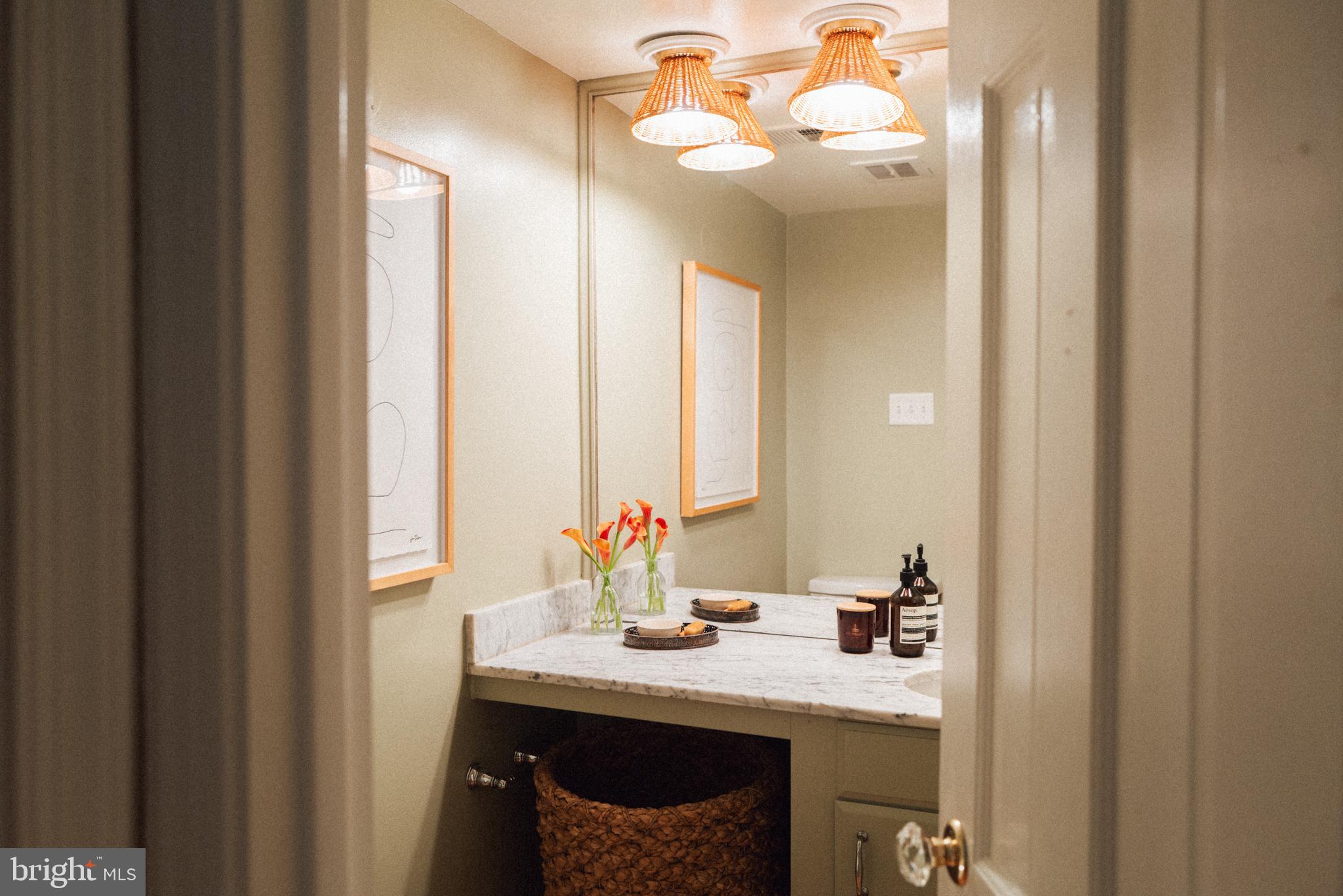 708 9th Street Southeast Washington, DC 20003 - Photo 14 of 31 a bathroom with a sink vanity and a mirror