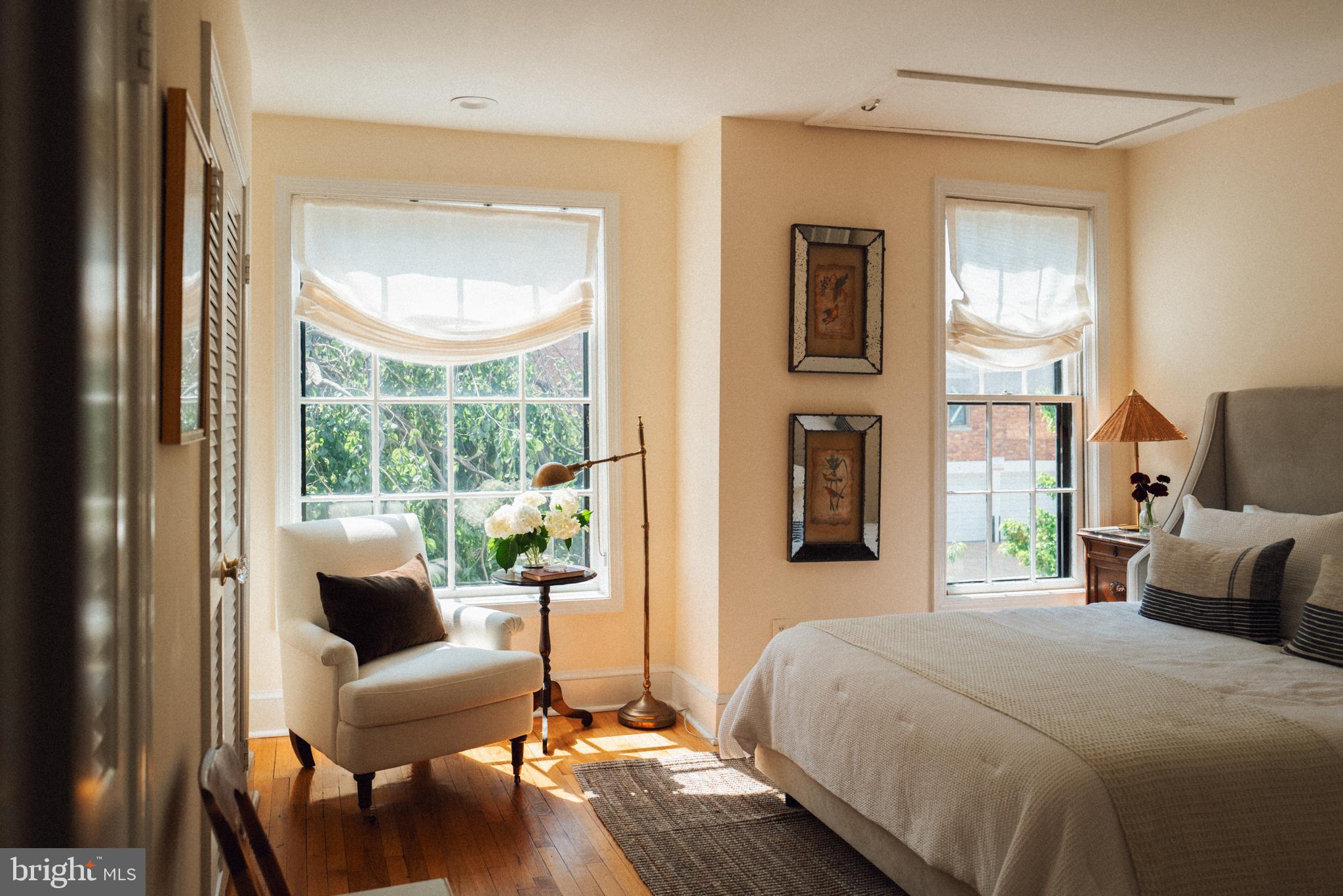 708 9th Street Southeast Washington, DC 20003 - Photo 16 of 31 a bedroom with a bed and wooden floor