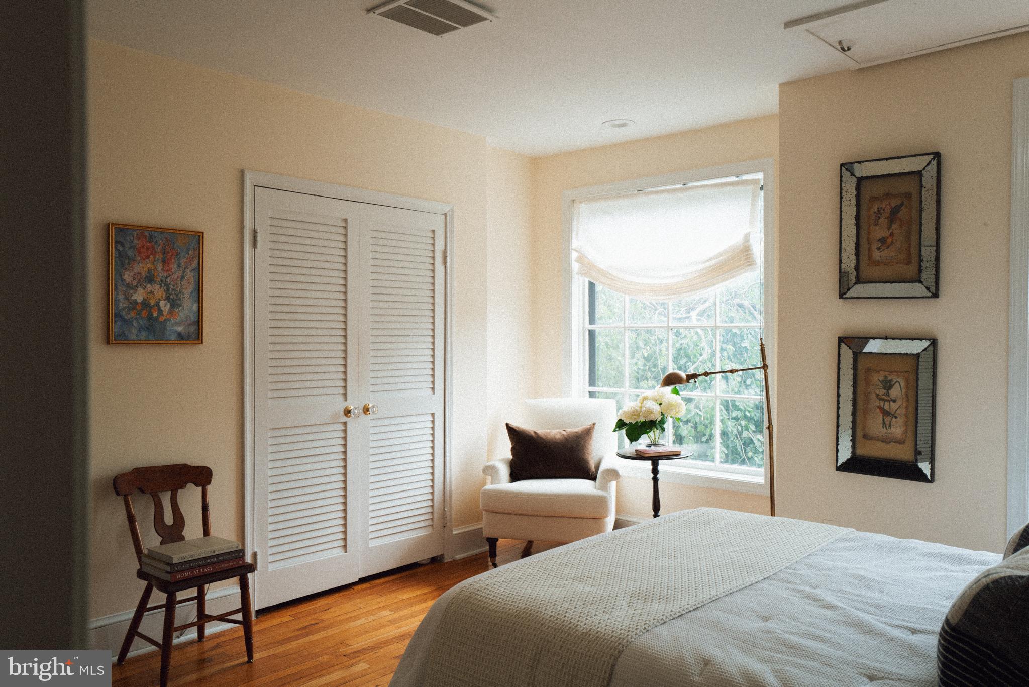 708 9th Street Southeast Washington, DC 20003 - Photo 17 of 31 a bedroom with a bed and a window