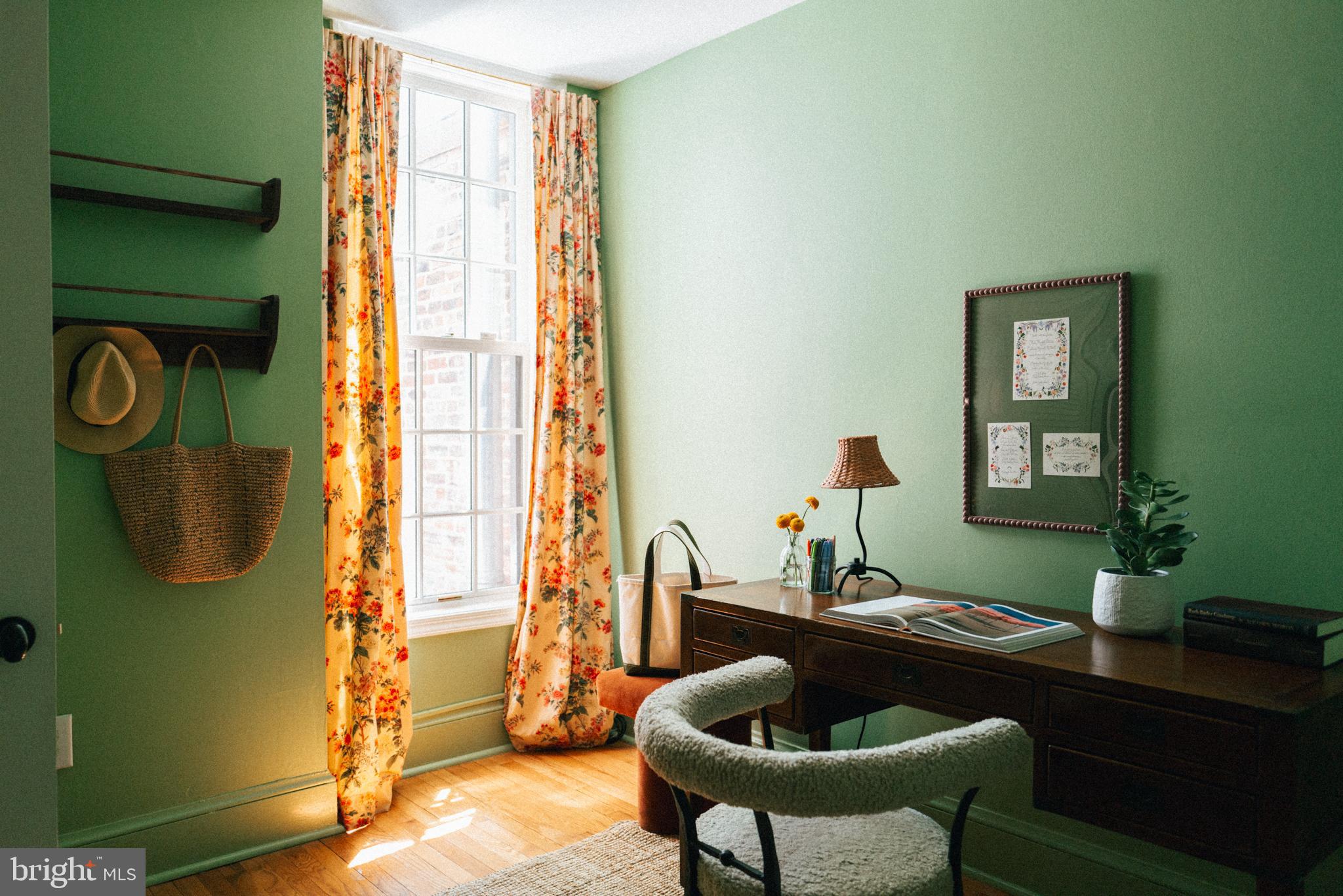 708 9th Street Southeast Washington, DC 20003 - Photo 26 of 31 a living room with furniture and a window