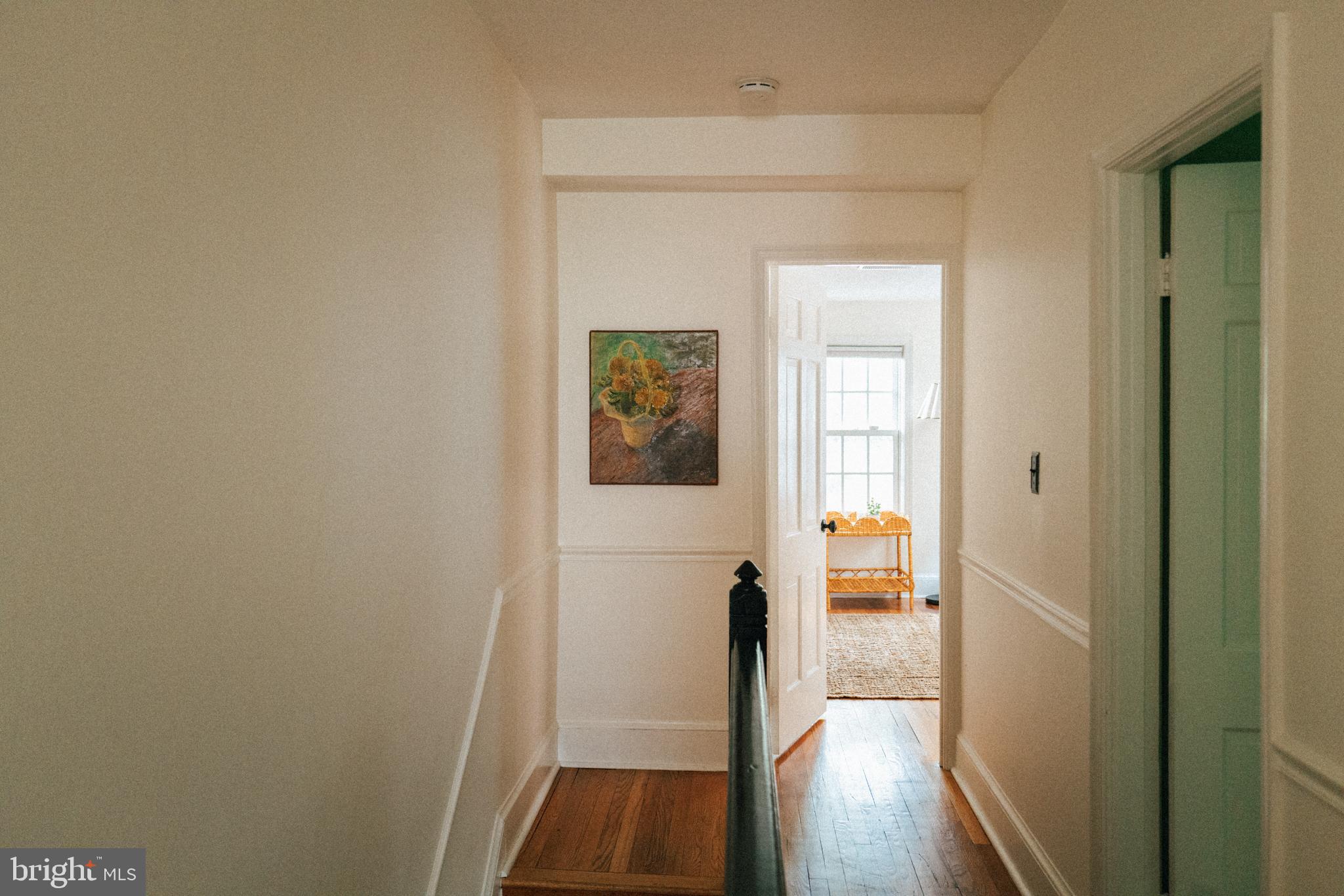708 9th Street Southeast Washington, DC 20003 - Photo 27 of 31 a hallway with wooden floor windows and a bathroom