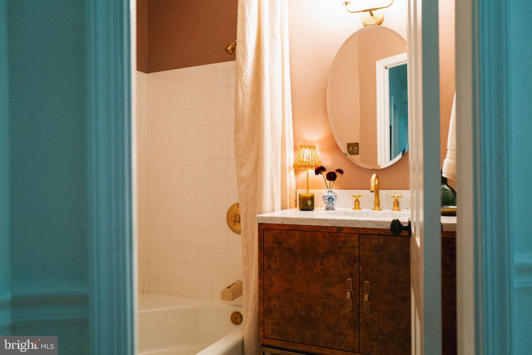 708 9th Street Southeast Washington, DC 20003 - Photo 28 of 31 a bathroom with a granite countertop sink and a mirror