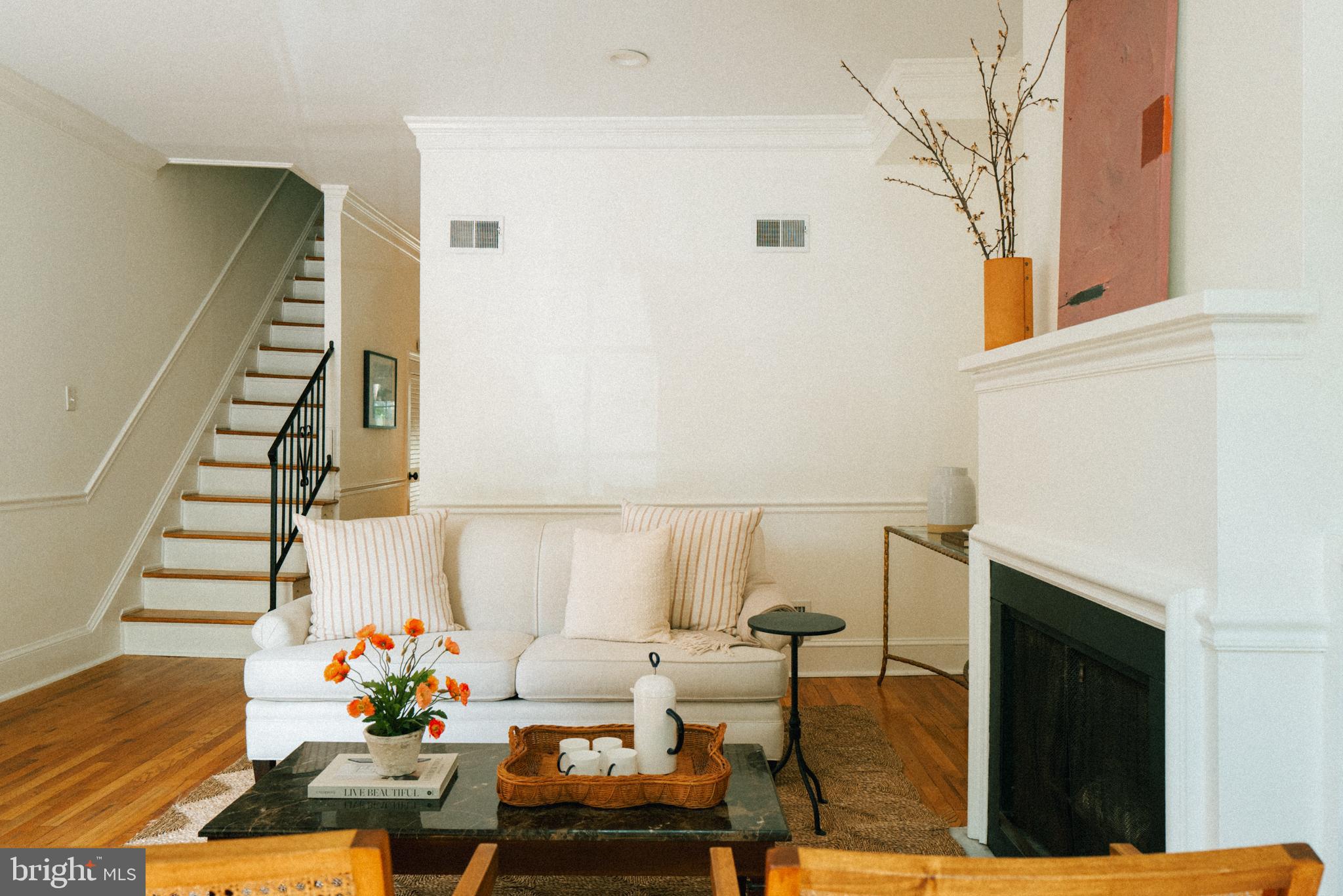 708 9th Street Southeast Washington, DC 20003 - Photo 5 of 31 a living room with furniture and flowers