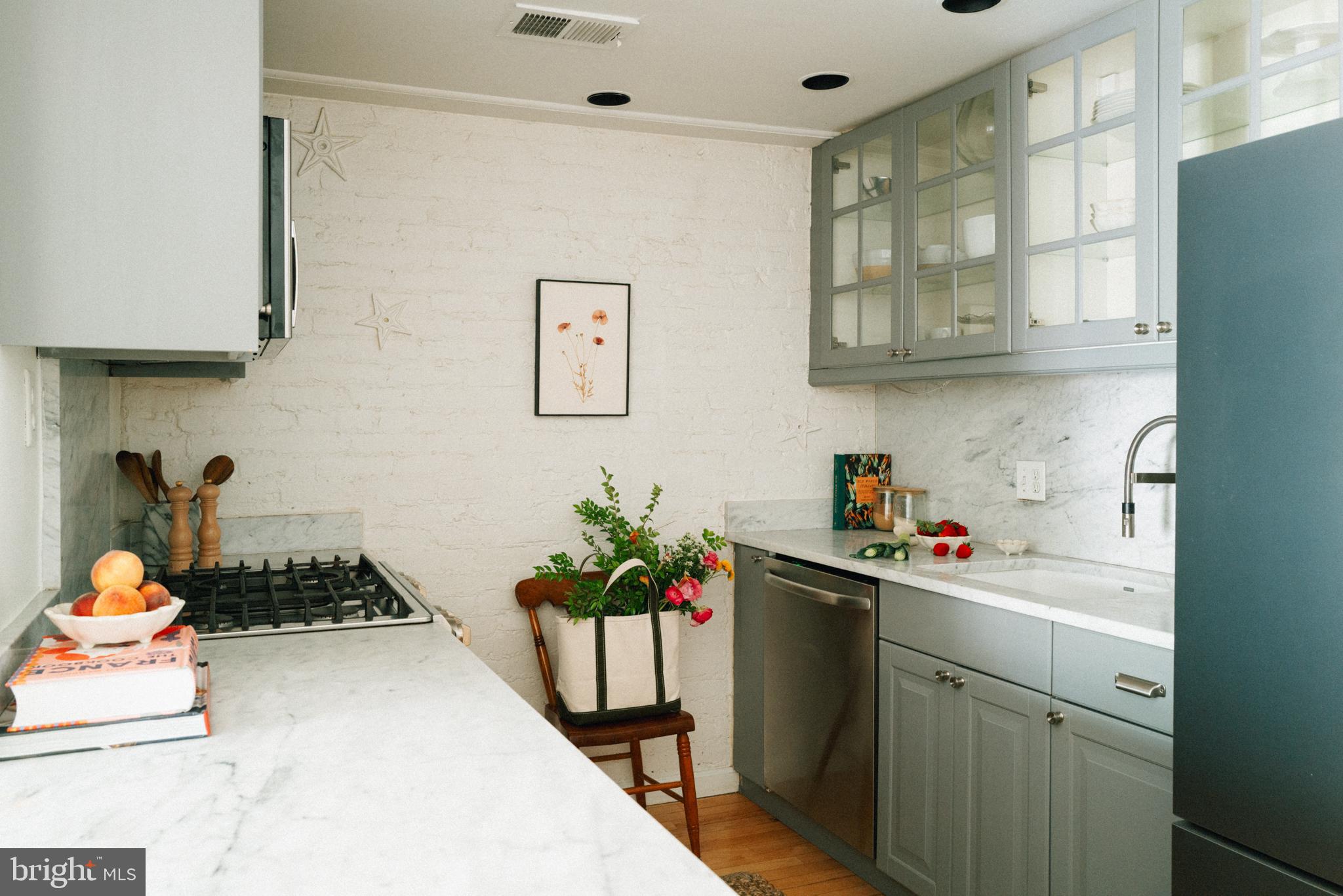 708 9th Street Southeast Washington, DC 20003 - Photo 8 of 31 a kitchen with a sink stove and cabinets