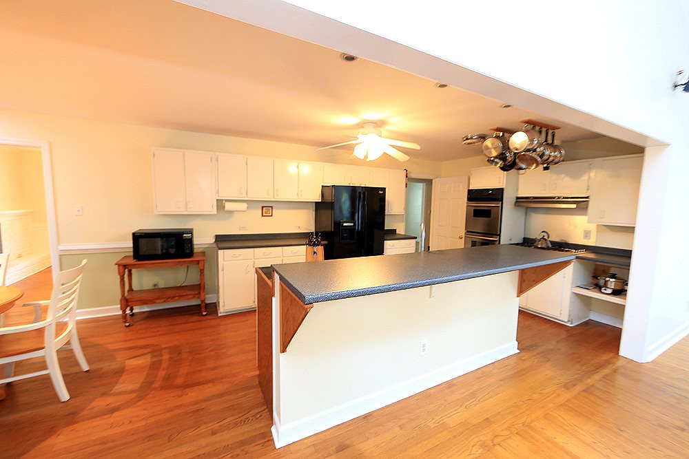 409 Vernon Terrace Raleigh, NC 27609 - Photo 4 of 23 A Chefs Kitchen Delight ! Roomy Enough for all the Cooks. Enjoy the Double Oven, Gas Stove and New Stainless Steel Sink. Refrigerator Conveys ! Kitchen