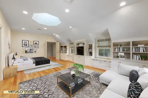 a living room with furniture or couch and a bookshelf