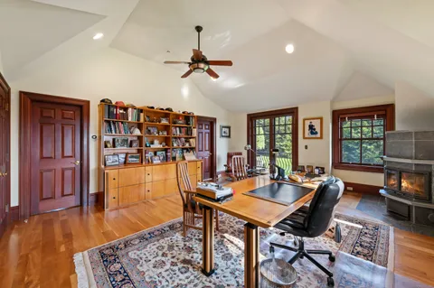 a view of a livingroom with furniture window and wooden floor