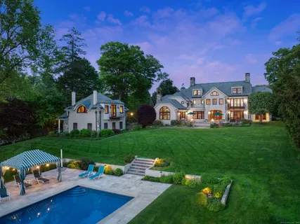 a view of an house with backyard space and garden
