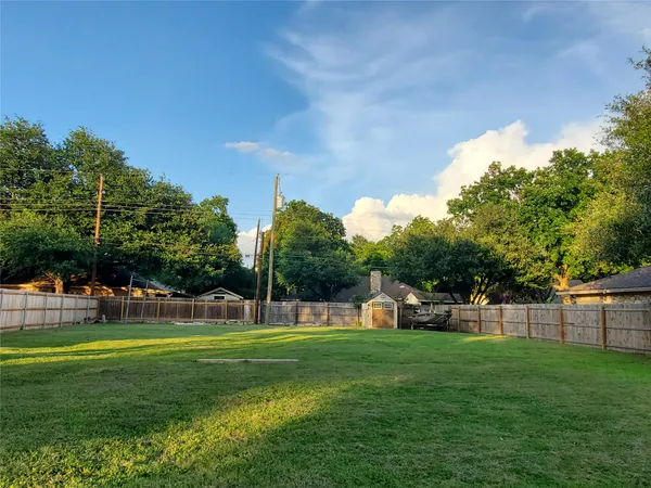 a view of a park with swings and slides