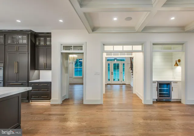 an empty room with wooden floor and fireplace