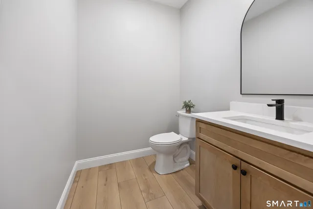 a bathroom with a toilet and a sink