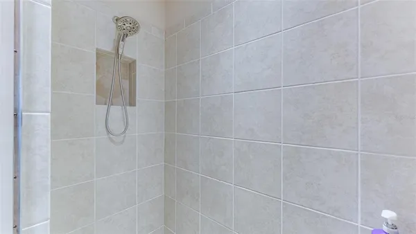 a view of a room with furniture and a garden