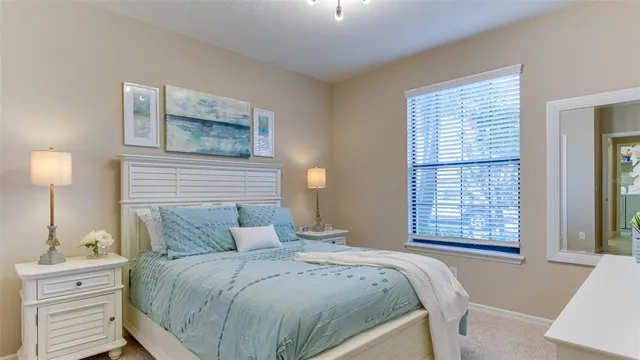 a view of a grassy field with trees