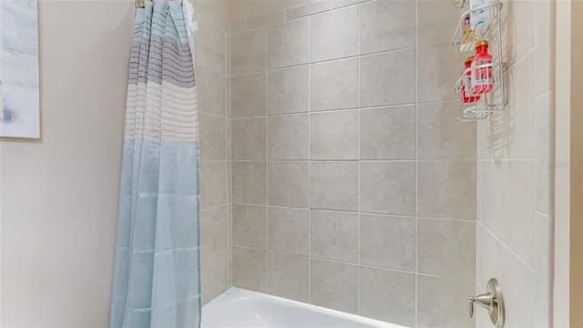 a view of a golf course with an ocean