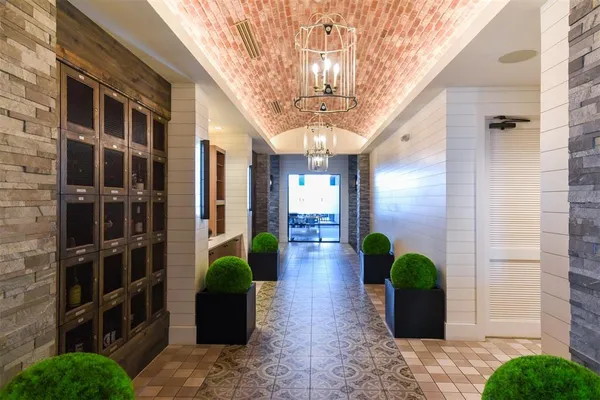 an aerial view of residential houses with outdoor space and swimming pool