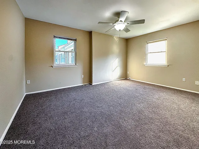 a bathroom with a sink toilet a mirror and shower