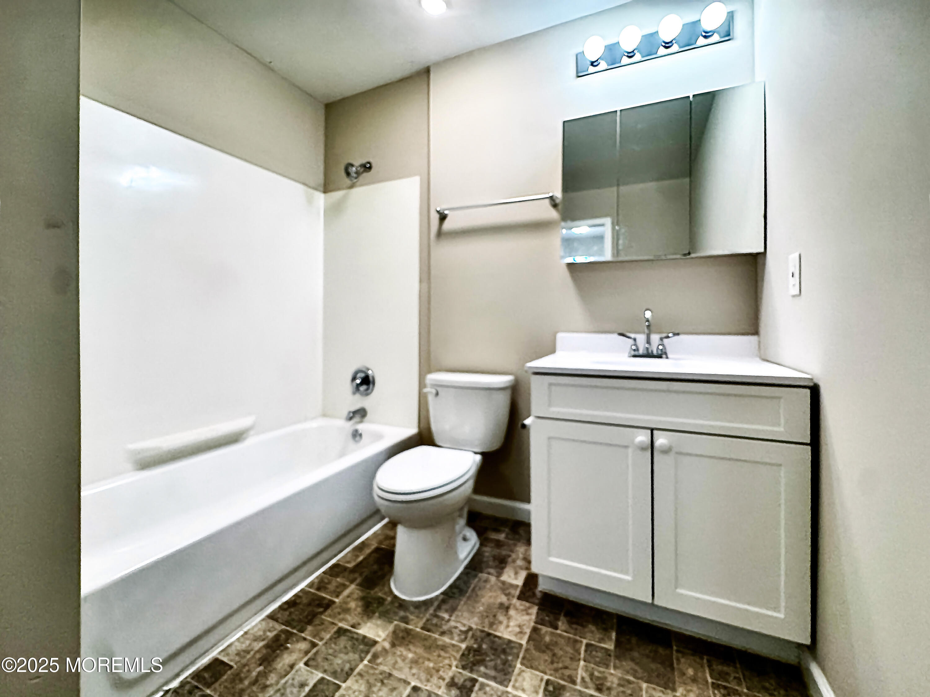 173 Primrose Lane Brick, NJ 08724 - Photo 20 of 24 a bathroom with a sink toilet a mirror and shower