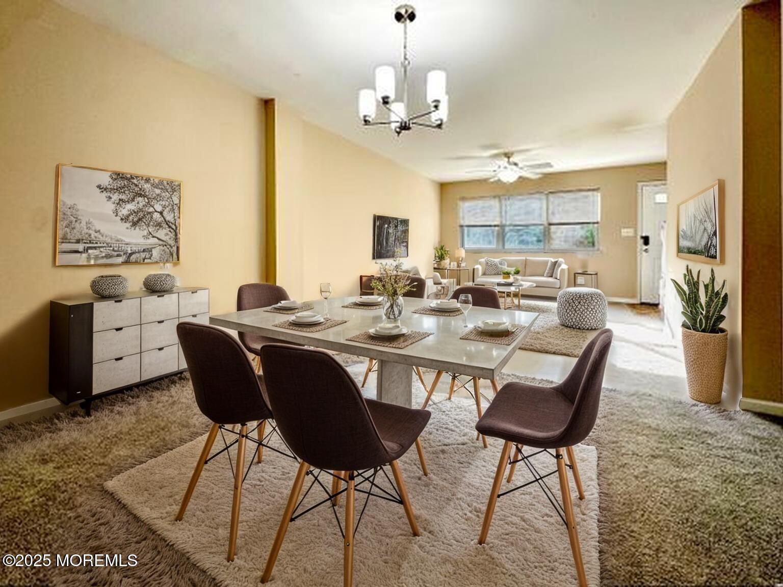 173 Primrose Lane Brick, NJ 08724 - Photo 8 of 24 a dining room with wooden floor and a chandelier