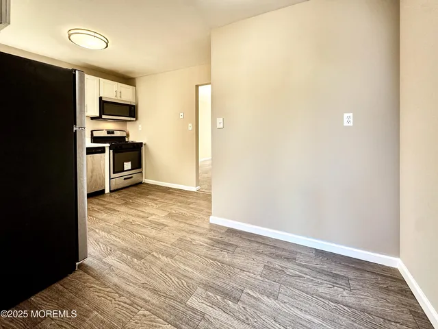a white refrigerator freezer sitting in a kitchen
