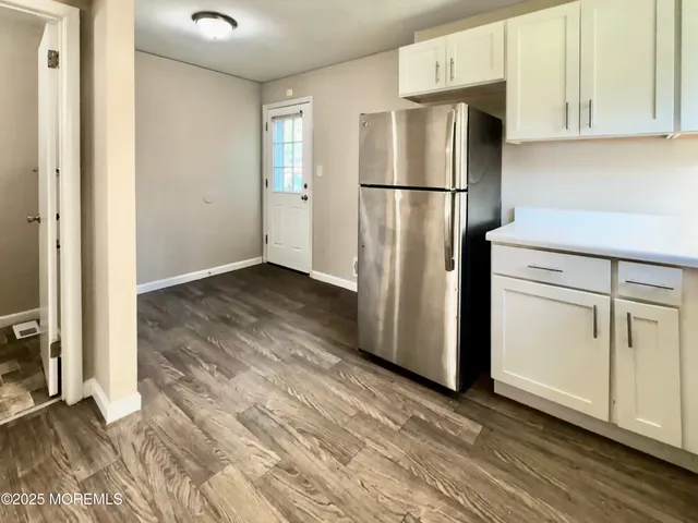 a kitchen with a refrigerator stove and microwave