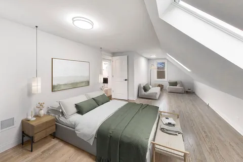 a bedroom with furniture and a wooden floor