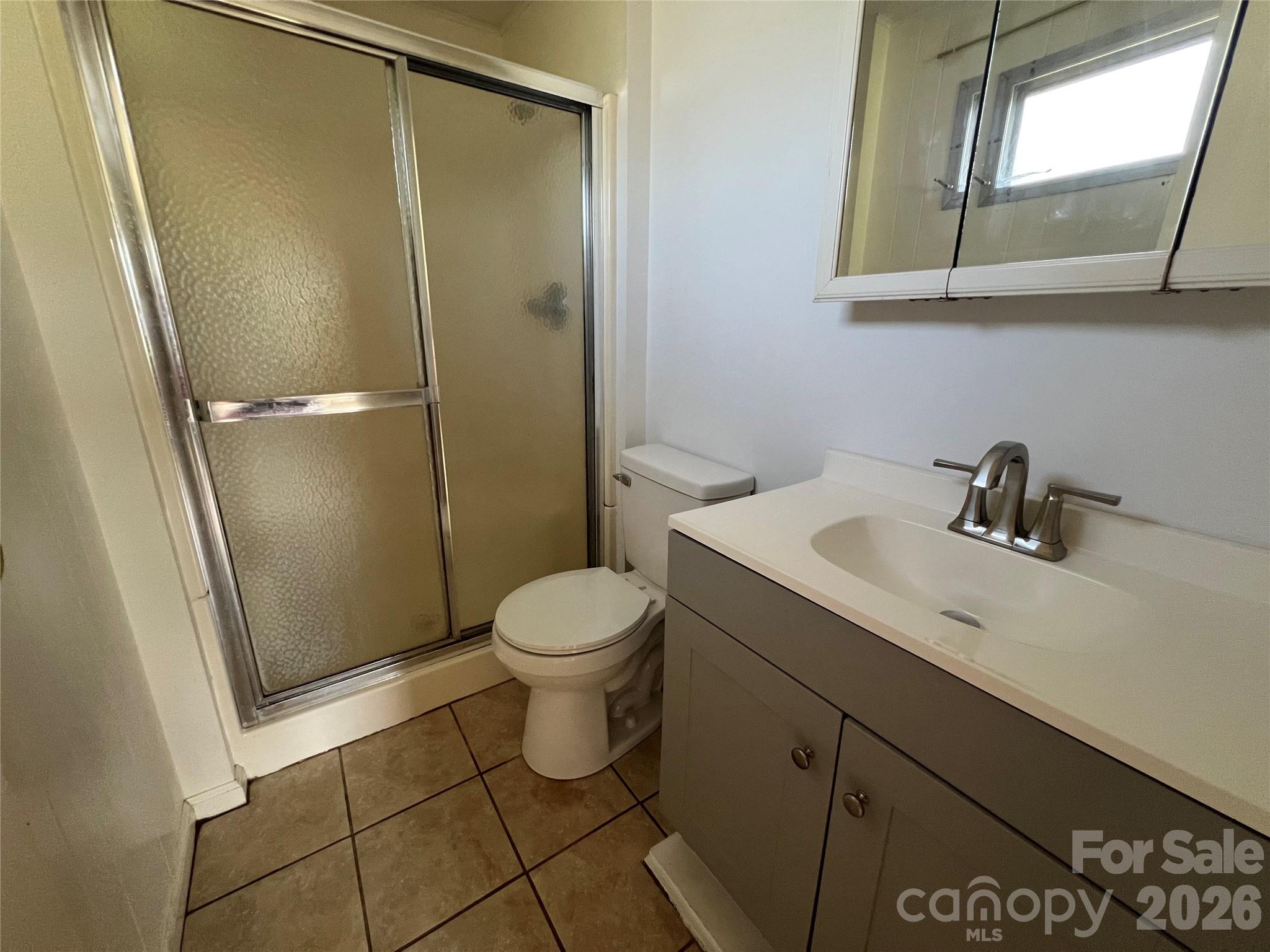 4405 Maple Creek Road Rutherfordton, NC 28139 - Photo 19 of 32 a bathroom with a toilet sink and shower