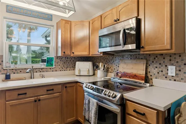 a kitchen with a stove and a microwave