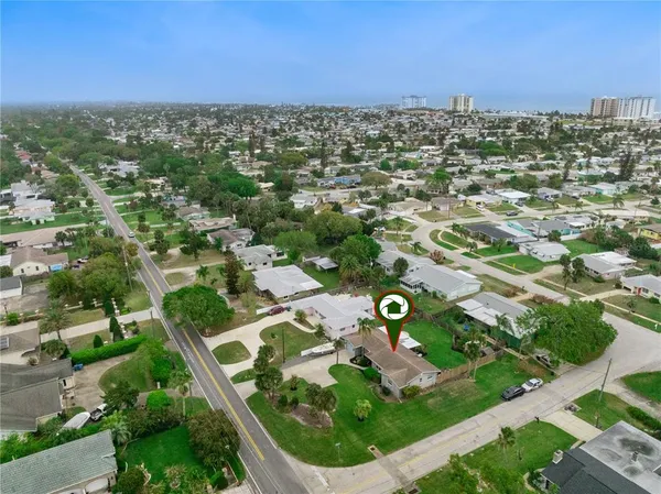 an aerial view of residential houses with outdoor space