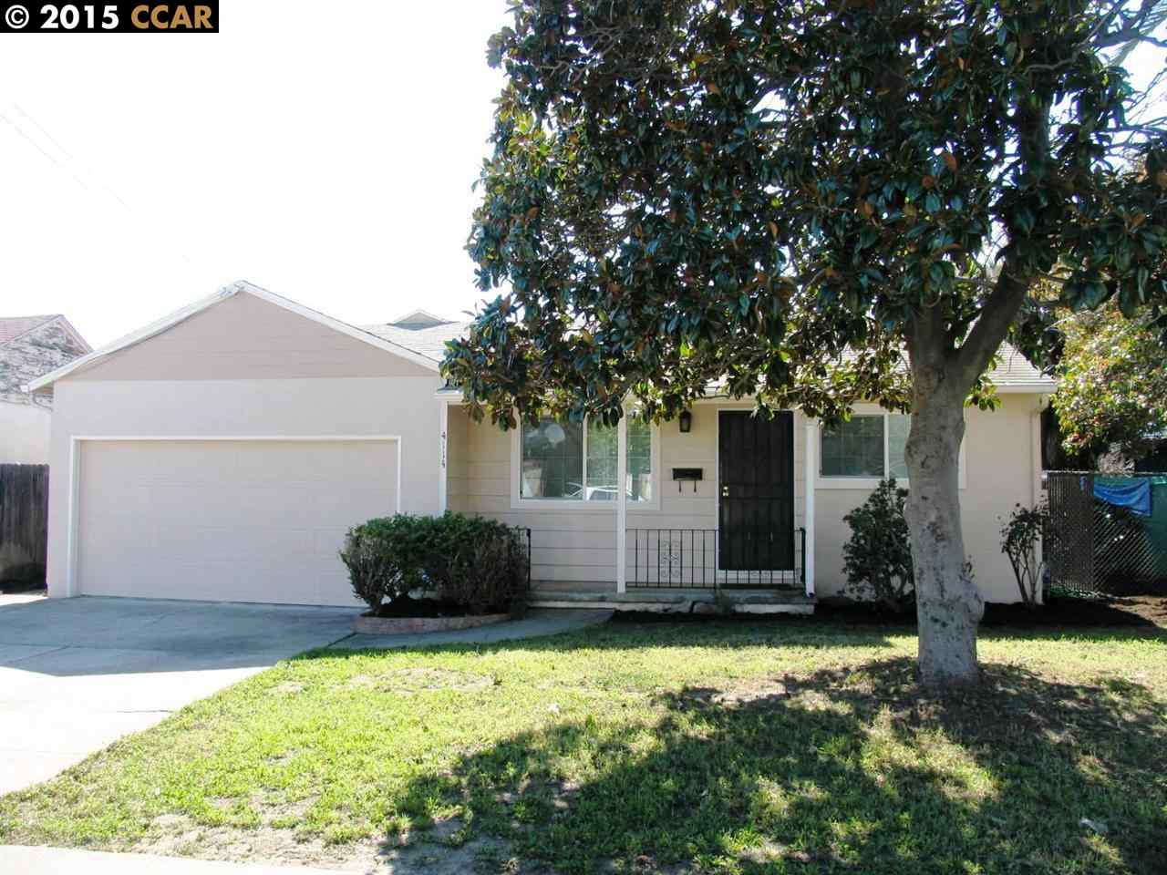a backyard of a house with yard and outdoor seating