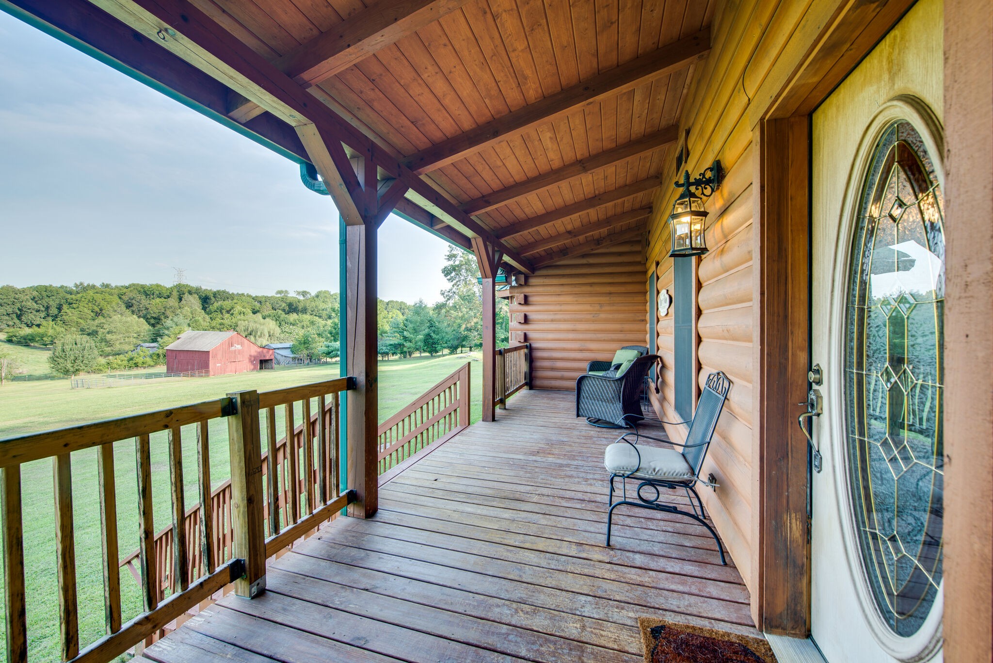1946 Mann Road Lebanon, TN 37087 - Photo 16 of 50 a view of a balcony with chairs and wooden floor