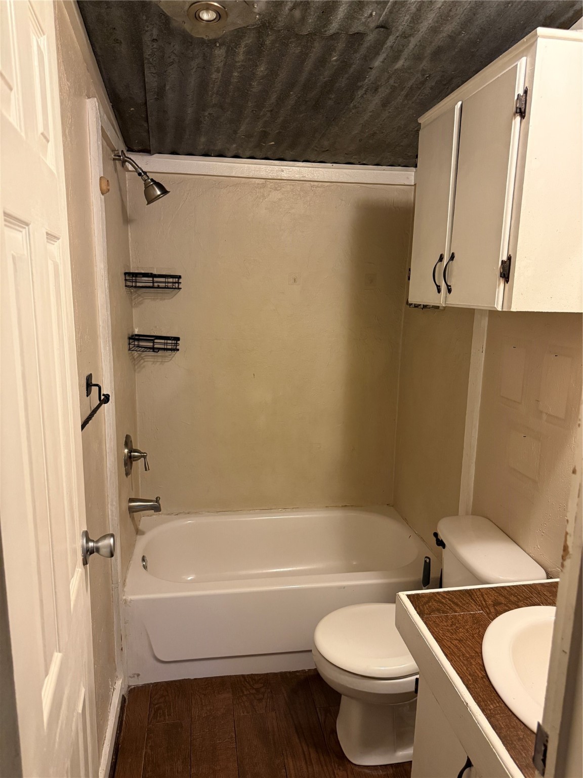 2611 Lilac Street Pasadena, TX 77503 - Photo 14 of 30 a bathroom with a sink a toilet and a bathtub