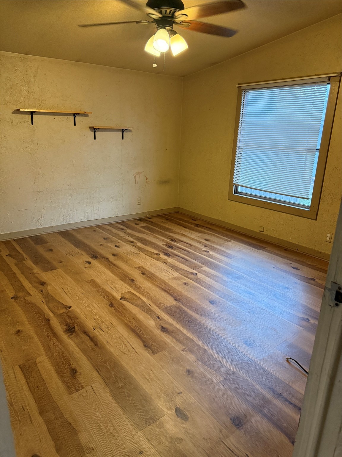 2611 Lilac Street Pasadena, TX 77503 - Photo 16 of 30 a view of a room with wooden floor and cabinet
