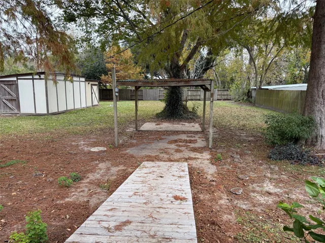 a view of a park with large trees