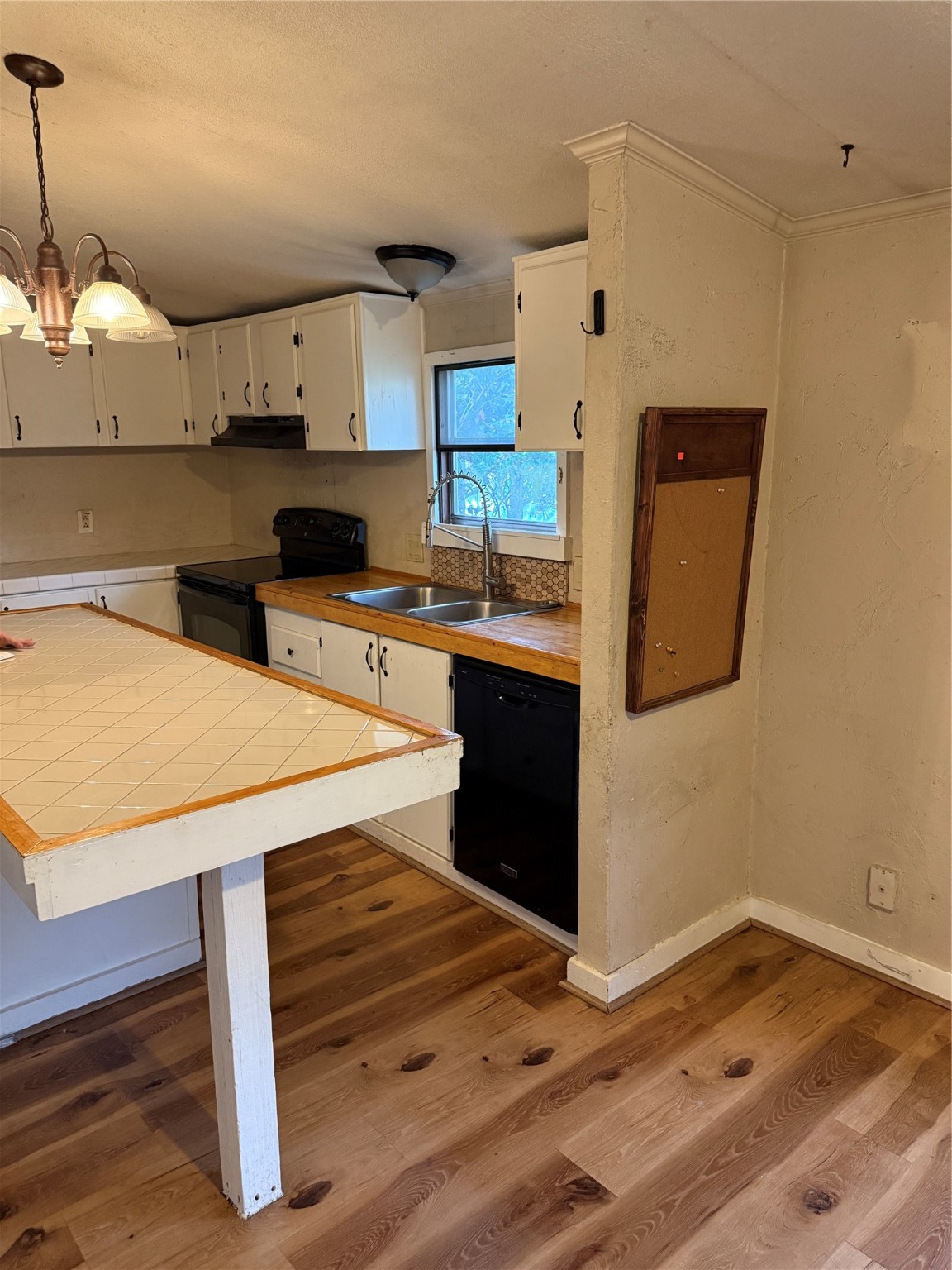 2611 Lilac Street Pasadena, TX 77503 - Photo 2 of 30 a kitchen with stainless steel appliances wooden cabinets and stove