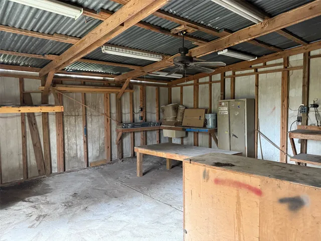 a view of a room with wooden walls