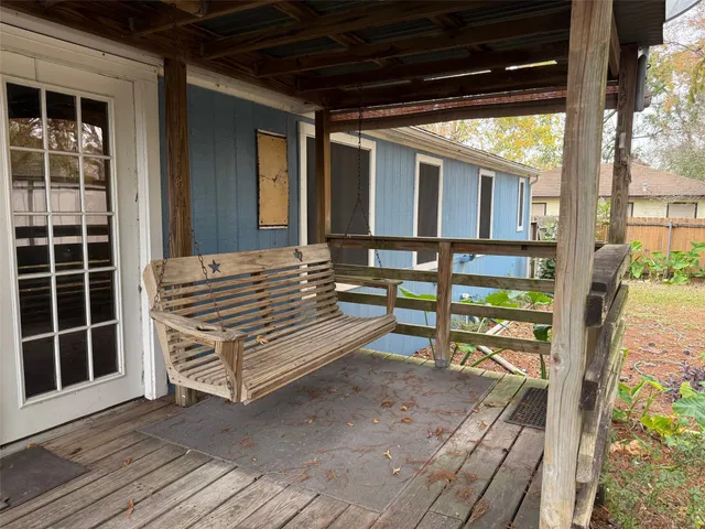 a view of outdoor space with deck and wooden floor