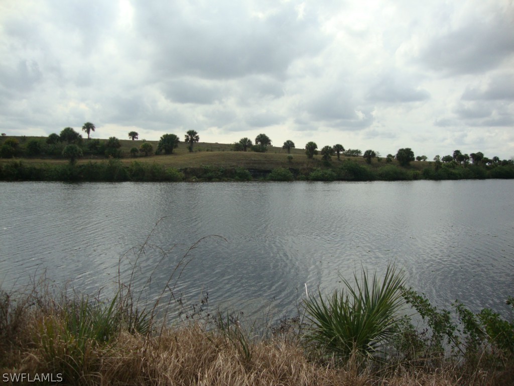 a view of a lake next to a lake with houses