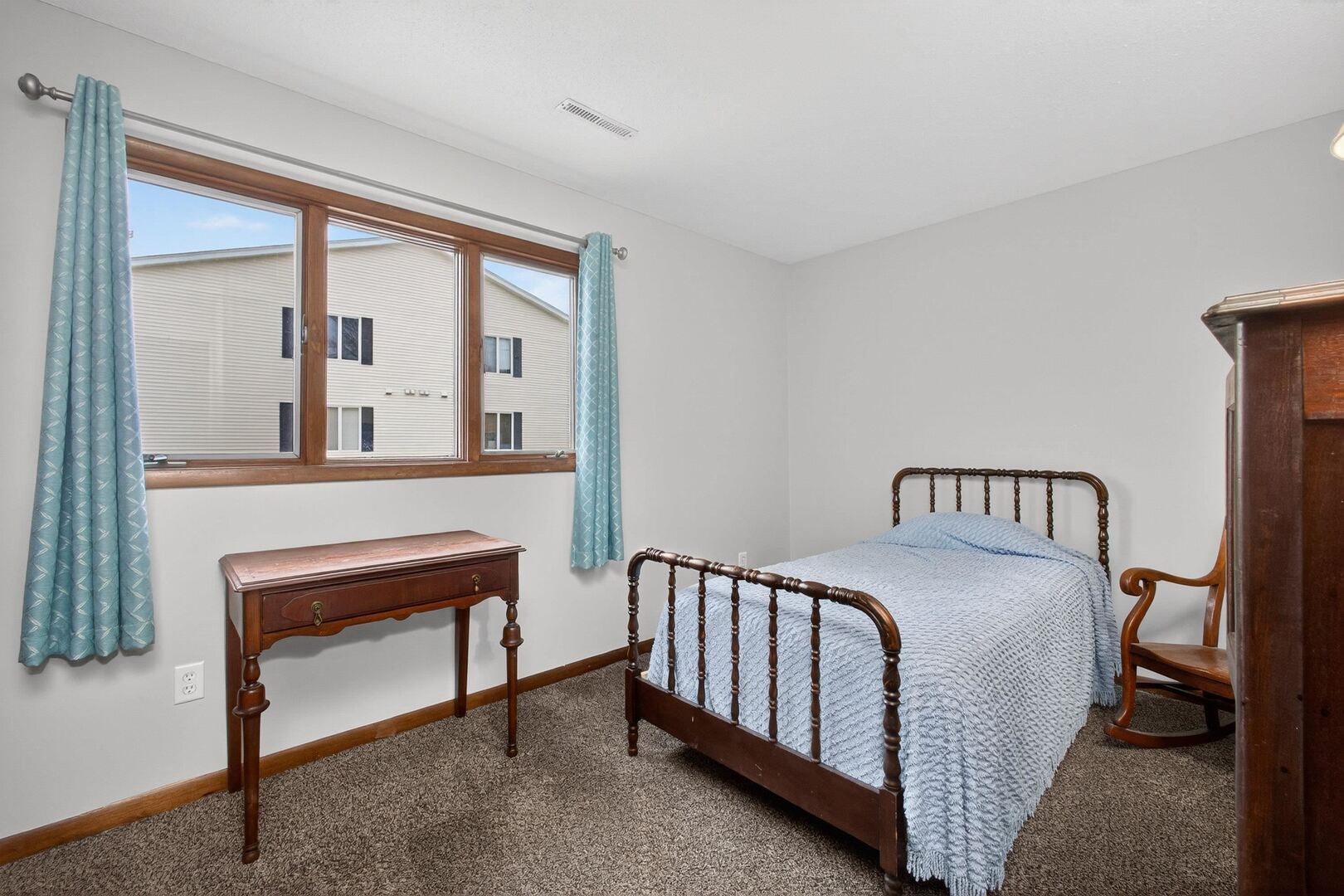 800 East Iowa Street, Unit 2C Eldridge, IA 52748 - Photo 18 of 28 a bedroom with a bed and a large window