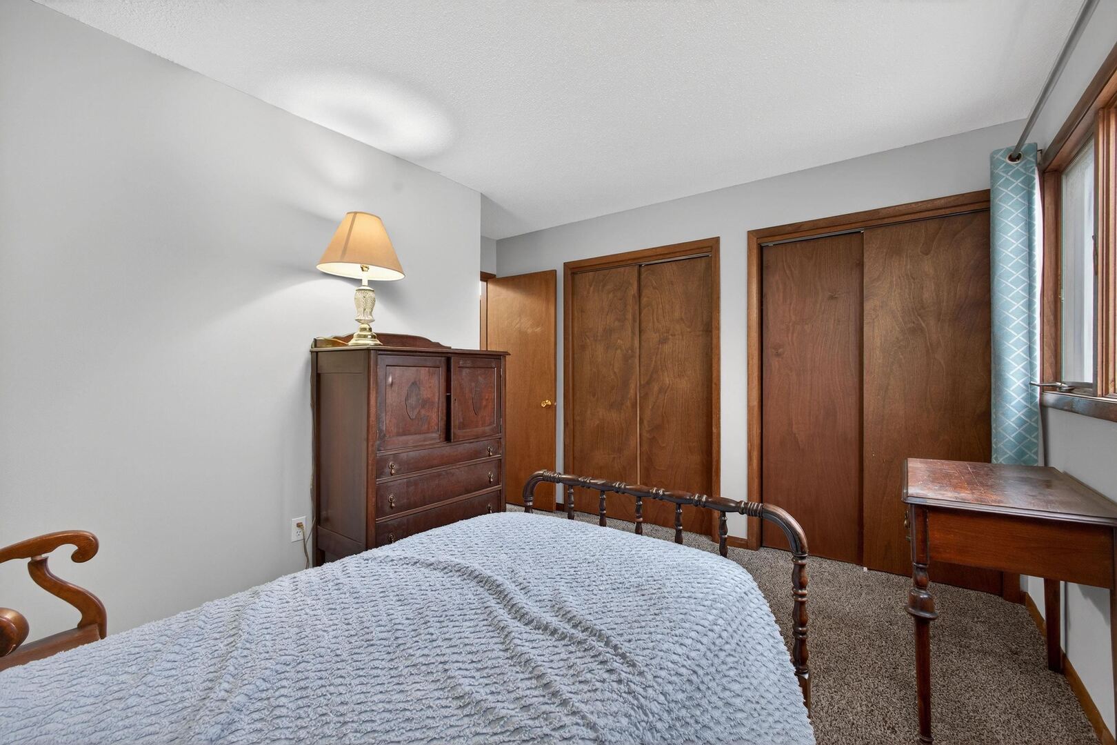 800 East Iowa Street, Unit 2C Eldridge, IA 52748 - Photo 20 of 28 a bedroom with a bed and a table in it