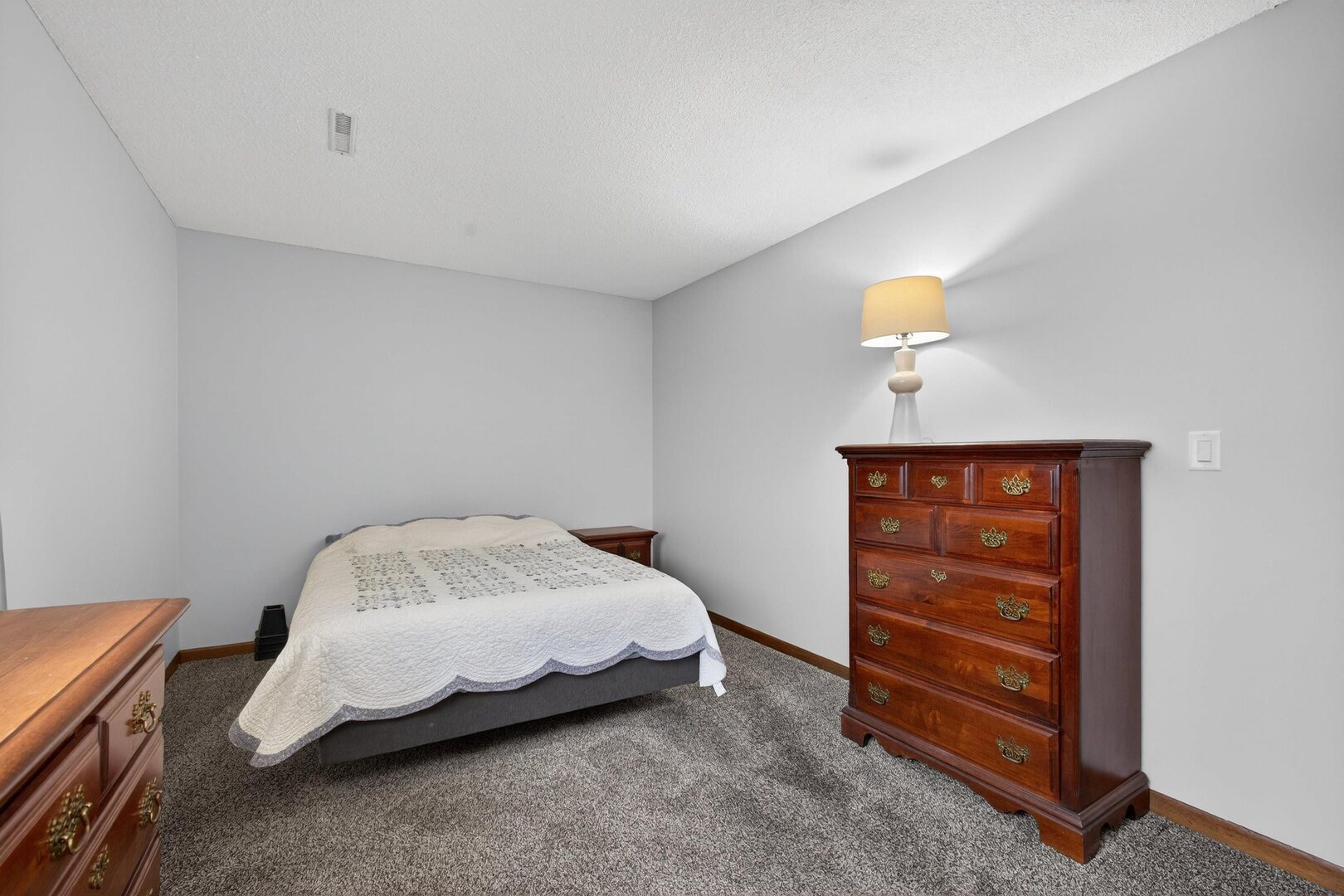 800 East Iowa Street, Unit 2C Eldridge, IA 52748 - Photo 22 of 28 a bedroom with a bed and a window