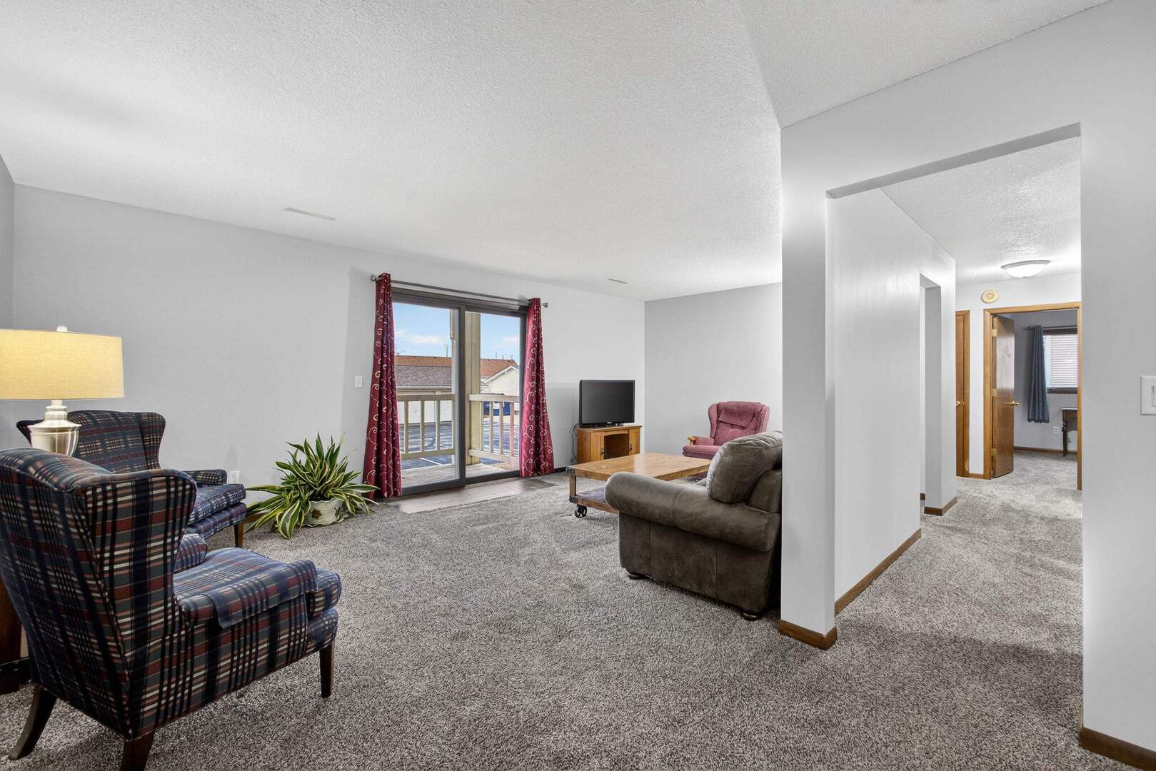 800 East Iowa Street, Unit 2C Eldridge, IA 52748 - Photo 4 of 28 a living room with furniture and a potted plant
