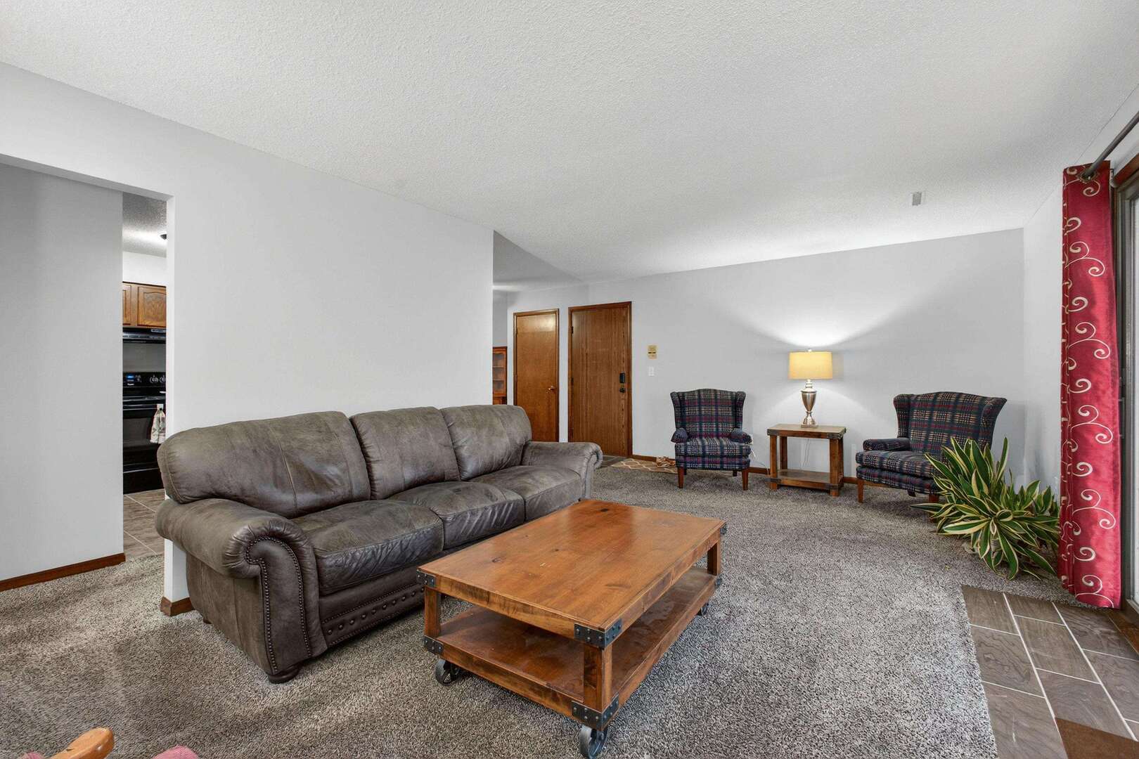 800 East Iowa Street, Unit 2C Eldridge, IA 52748 - Photo 7 of 28 a living room with furniture and a fireplace