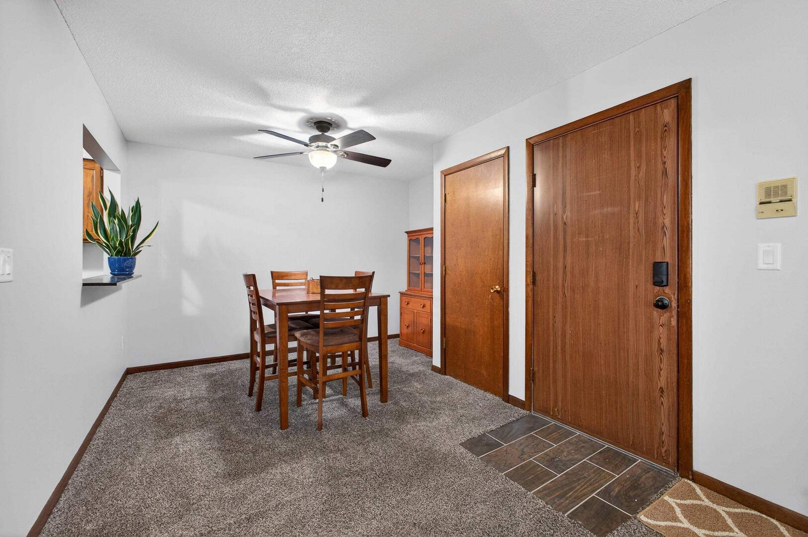 800 East Iowa Street, Unit 2C Eldridge, IA 52748 - Photo 9 of 28 a view of a livingroom with furniture and chandelier fan