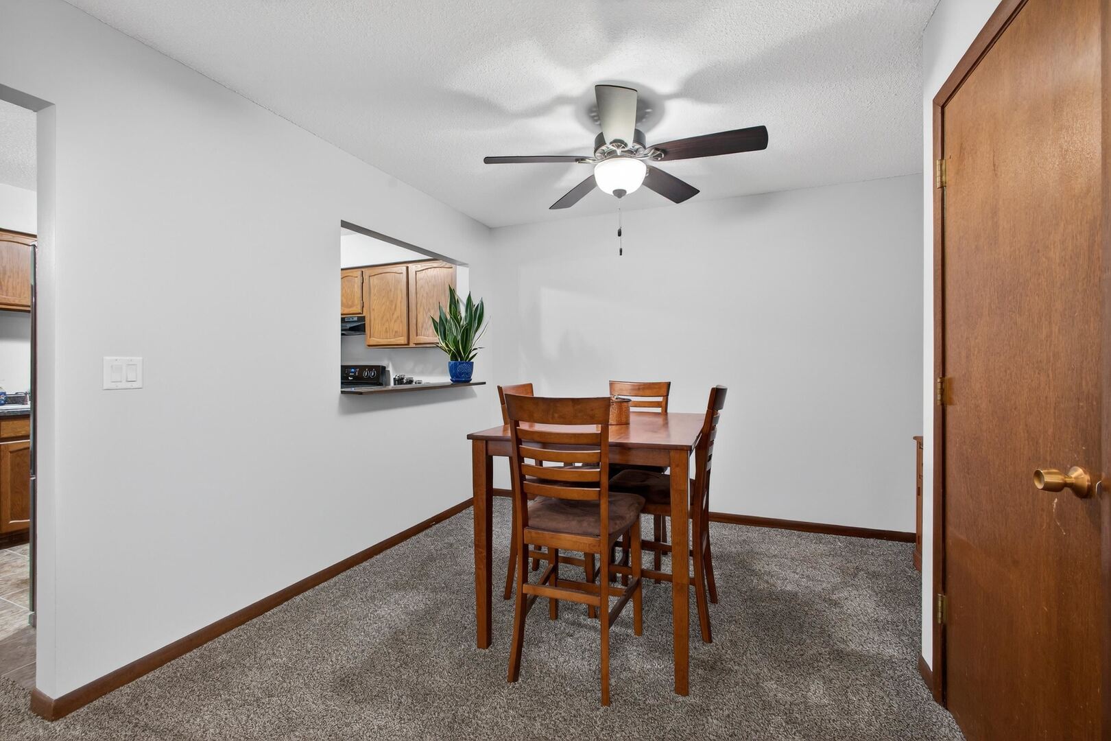 800 East Iowa Street, Unit 2C Eldridge, IA 52748 - Photo 10 of 28 a view of a dining room with furniture