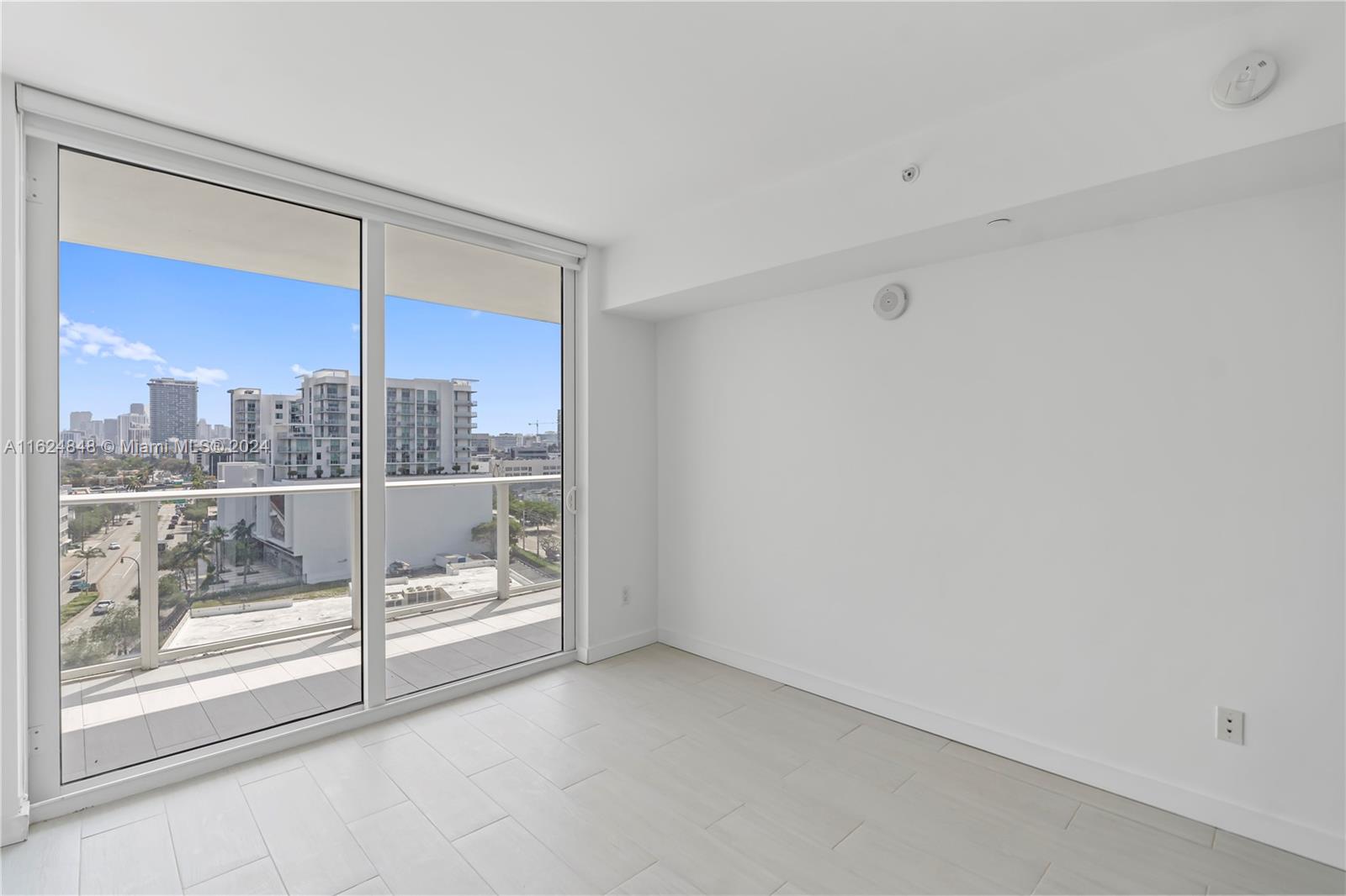 4250 Biscayne Boulevard, Unit 1018 Miami, FL 33137 - Photo 15 of 54 a view of a room with a large window