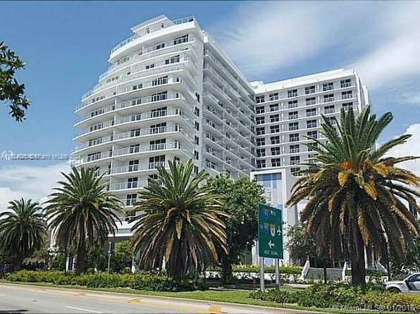 4250 Biscayne Boulevard, Unit 1018 Miami, FL 33137 - Photo 16 of 54 a tall building with a palm trees