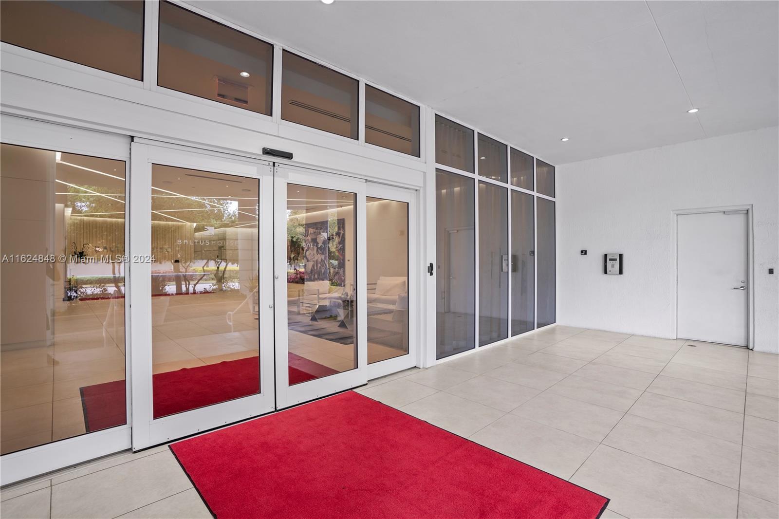 4250 Biscayne Boulevard, Unit 1018 Miami, FL 33137 - Photo 17 of 54 a view of a room with a balcony and front door